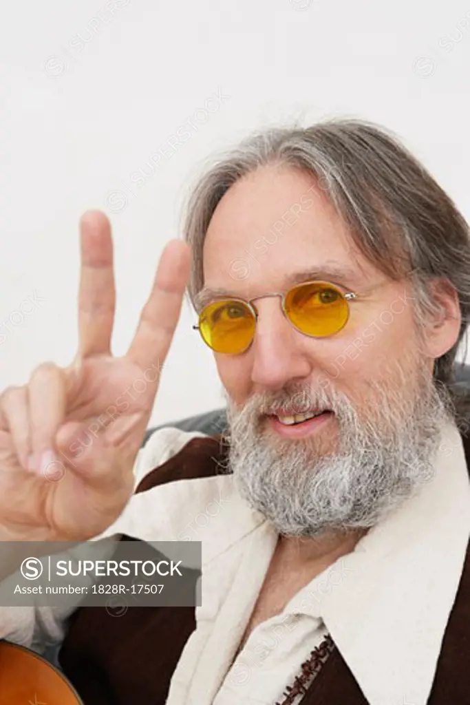 Portrait of Man Making Peace Sign   