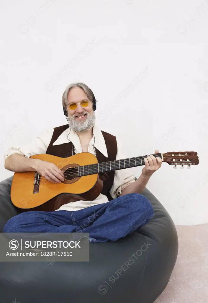 Portrait of Man Playing Guitar   
