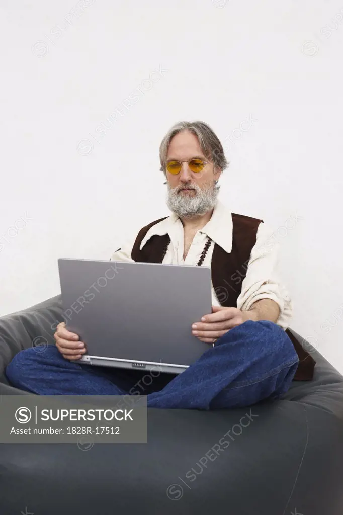 Man Looking at Laptop Computer   