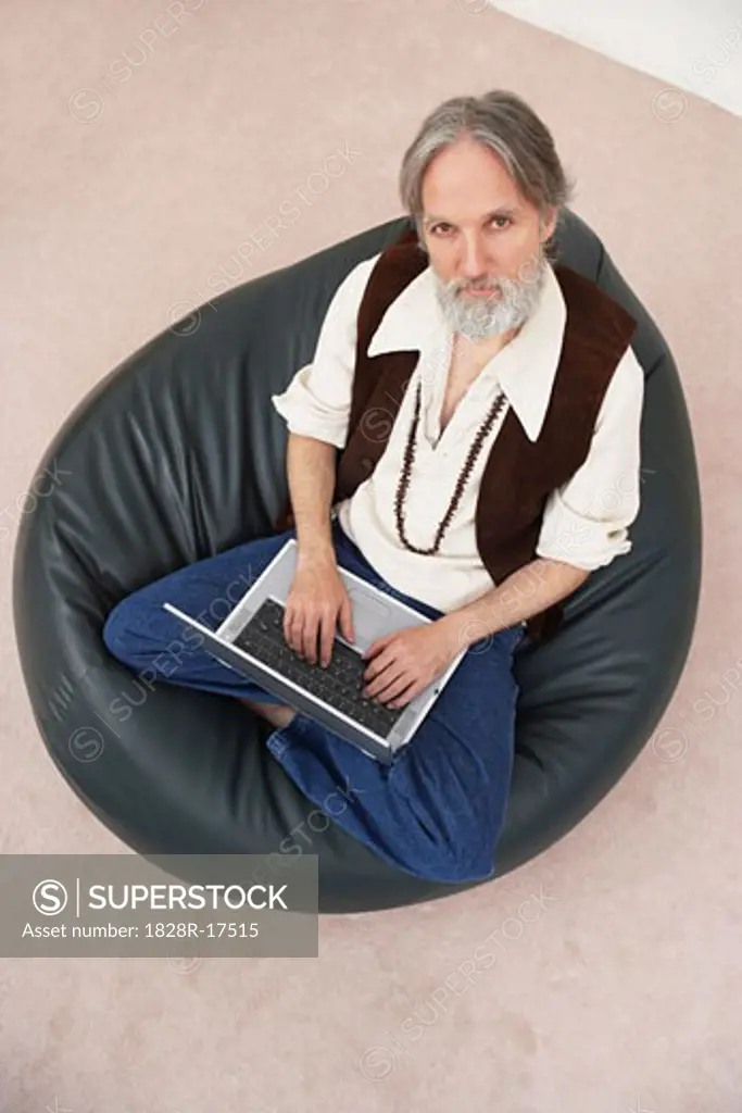 Portrait of Man Using Laptop Computer   