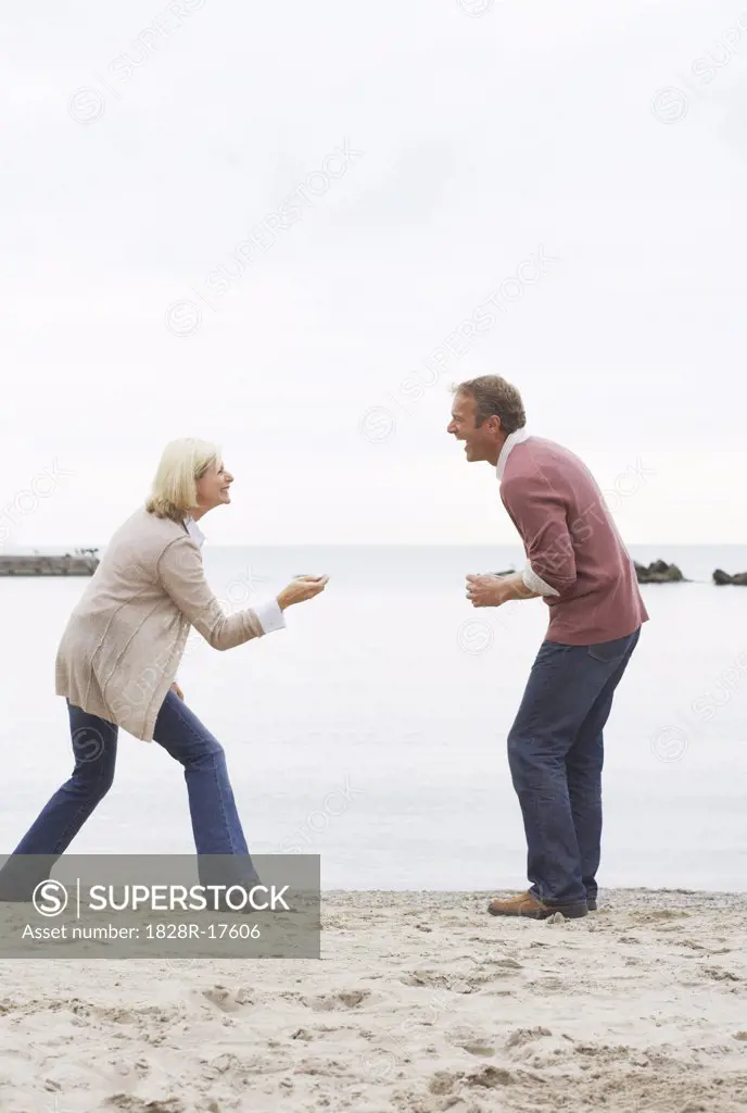 Couple Throwing Stones, Sunnyside Park, Toronto, Ontario, Canada   