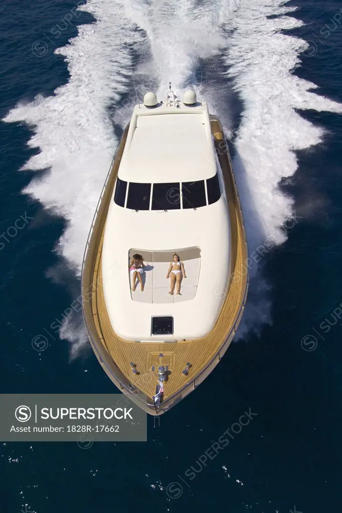 Women Sunbathing on Speedboat   