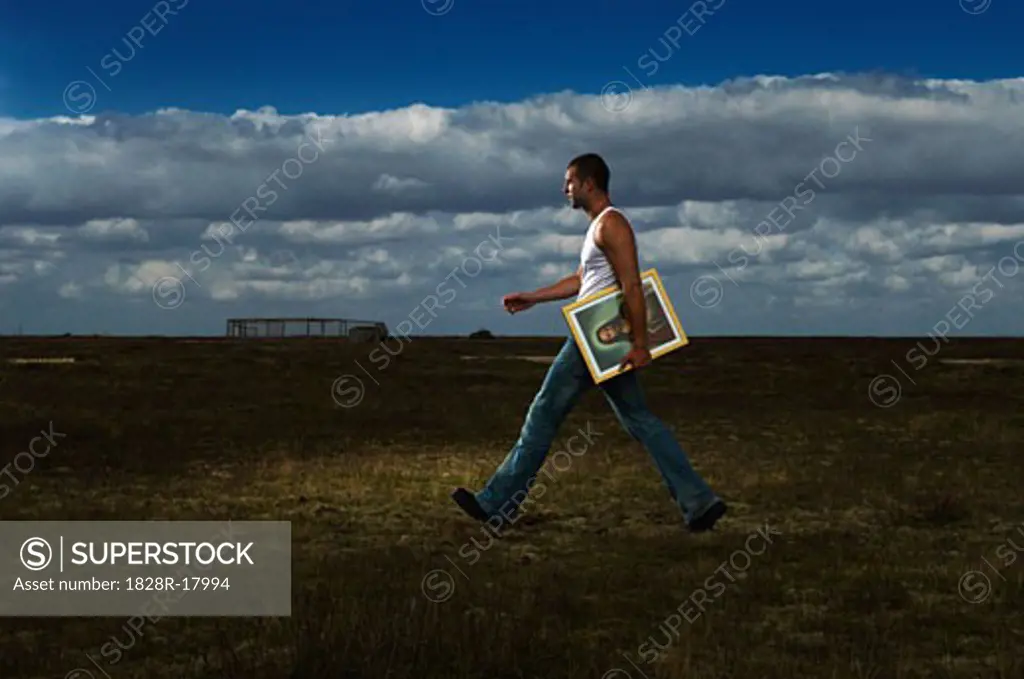 Man Carrying Picture of Jesus   
