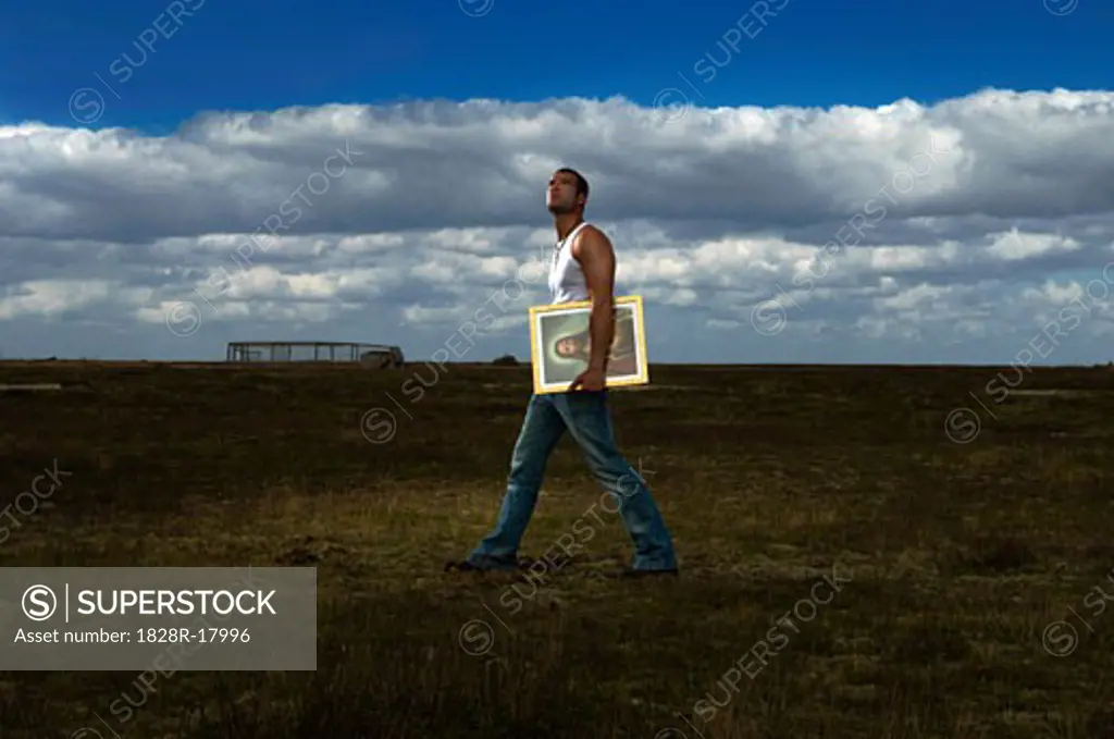 Man Carrying Picture of Jesus   