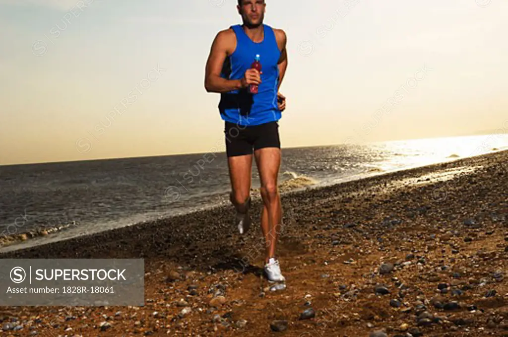 Man Jogging on the Beach   