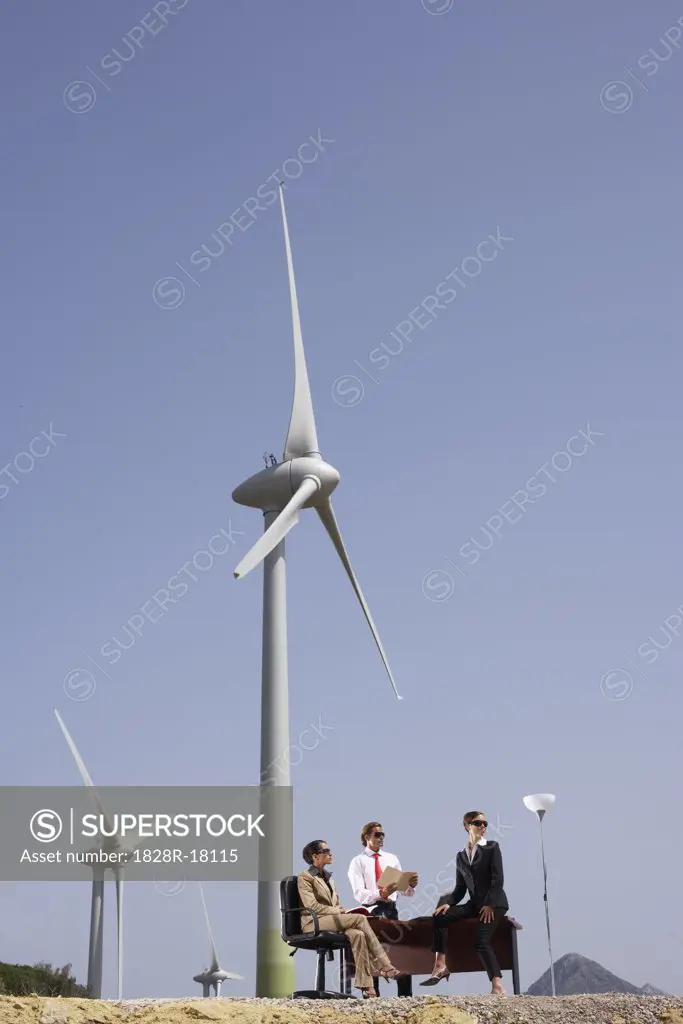 Business People at Desk by Wind Farm   