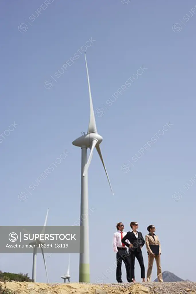 Business People by Wind Farm   