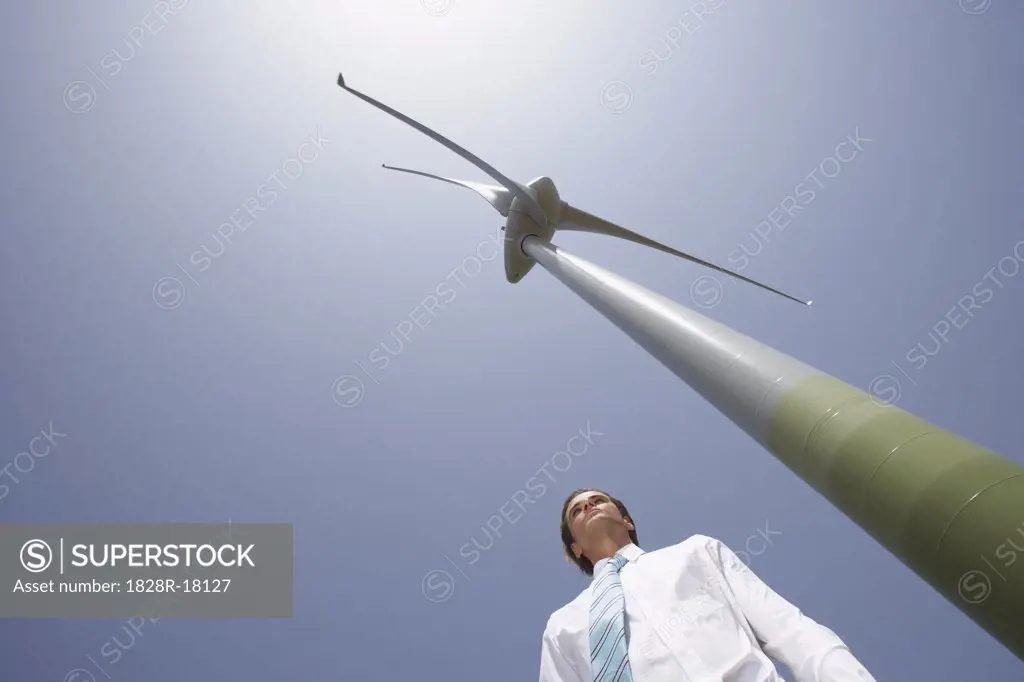 Businessman by Wind Tower   