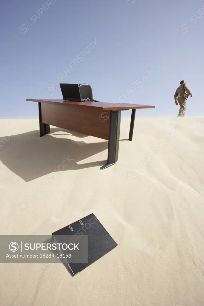 Businessman Leaving Workspace in Desert   