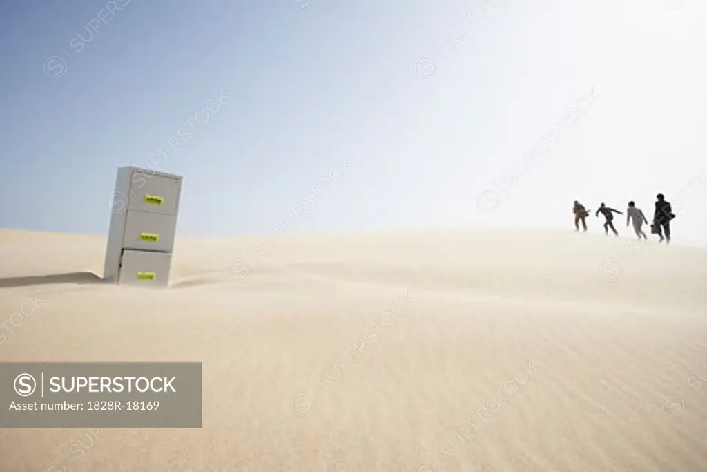 Business People and Filing Cabinet in Desert   