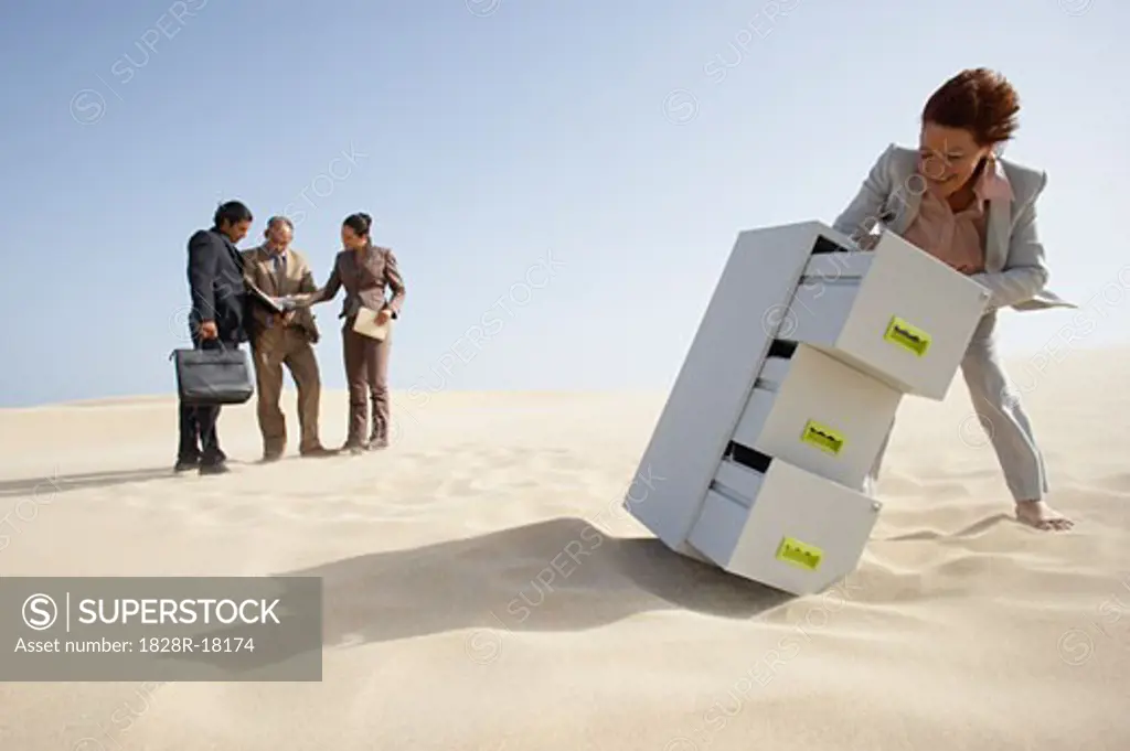 Business People and Filing Cabinet in Desert   