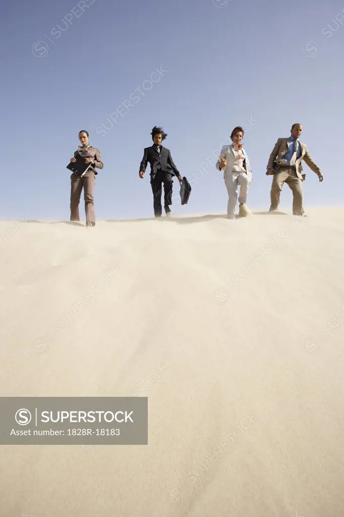Business People Descending Dune   