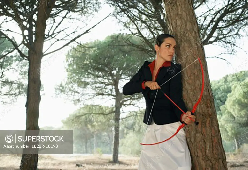 Businesswoman Using Bow and Arrow   