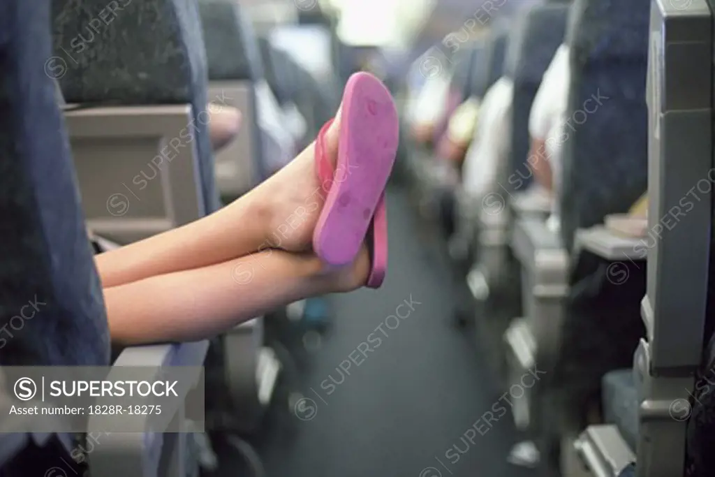 Girl's Feet in Airplane   