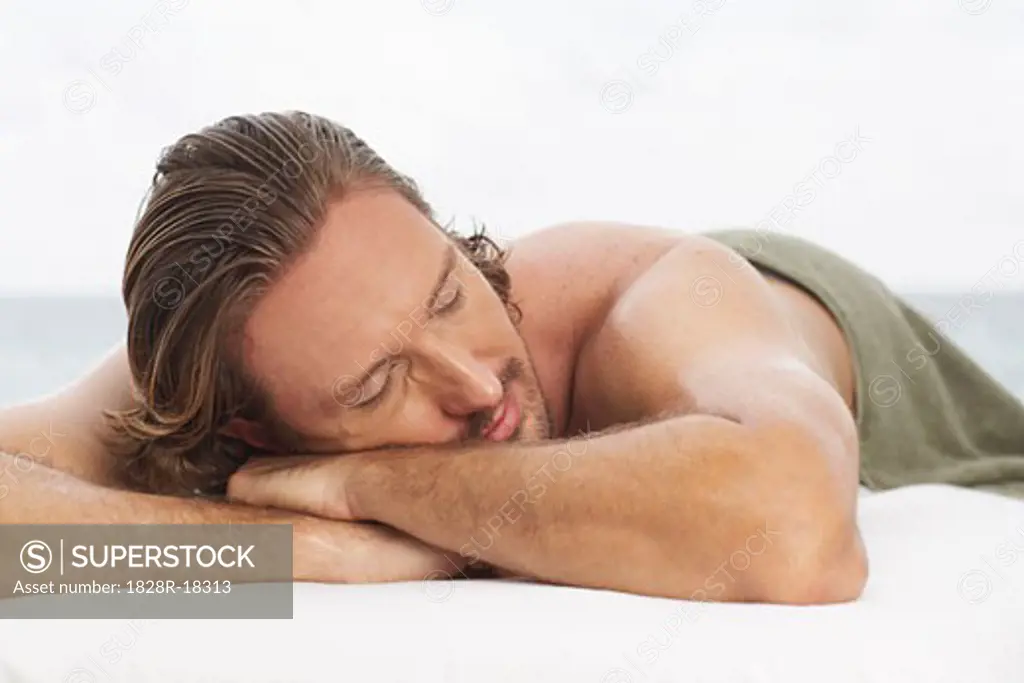 Man Lying on Massage Table   
