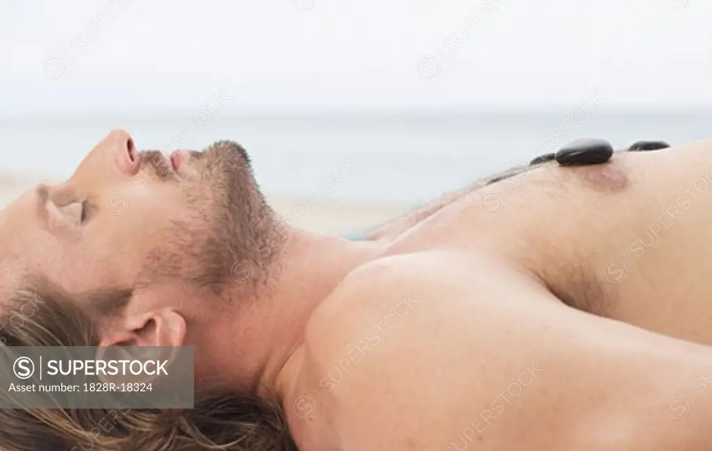 Man Getting Warming Rock Therapy   