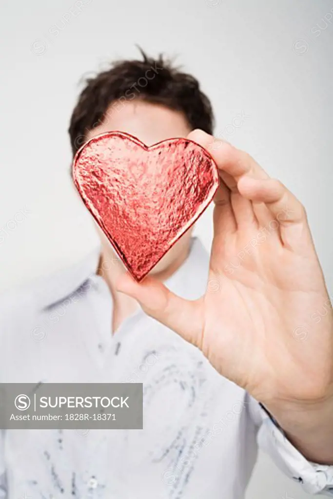 Man Holding Heart-Shaped Box   