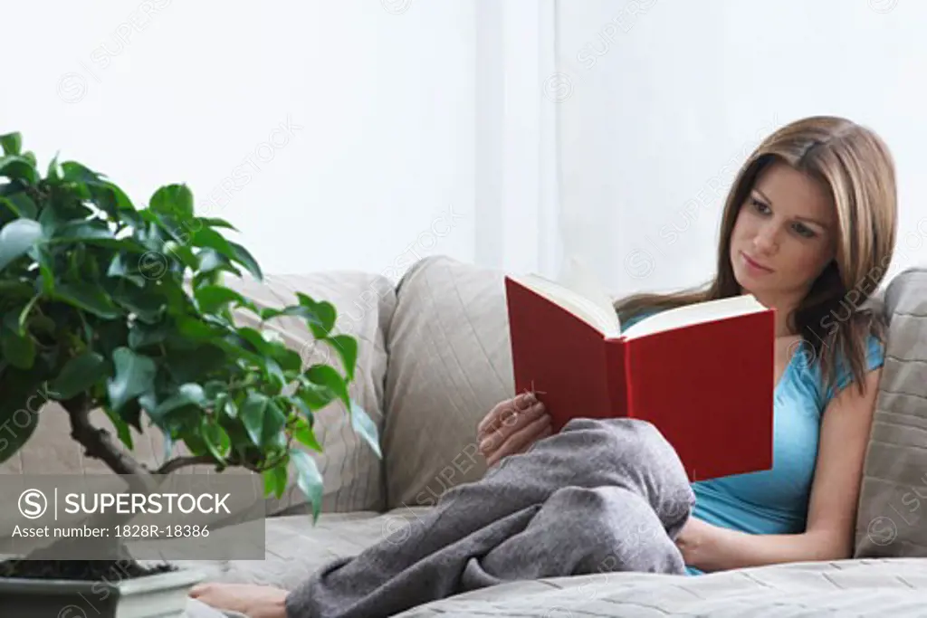 Woman on Sofa, Reading Book   