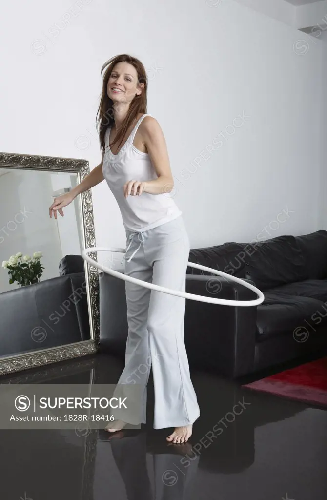 Woman Using Hula Hoop at Home   