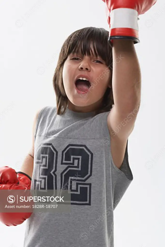 Portrait of Boy Wearing Boxing Gloves   