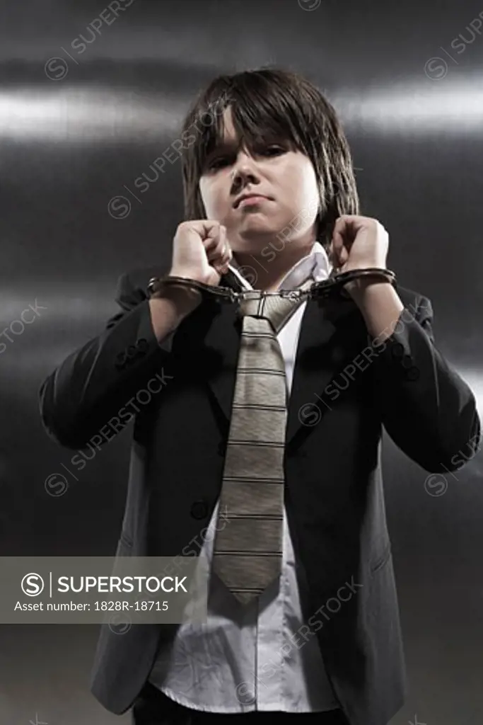Portrait of Boy in Handcuffs   