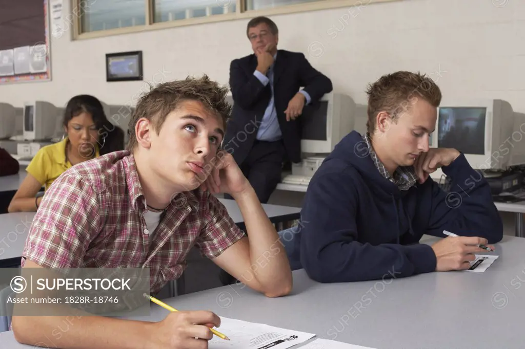 Teacher Watching Students Taking Test   