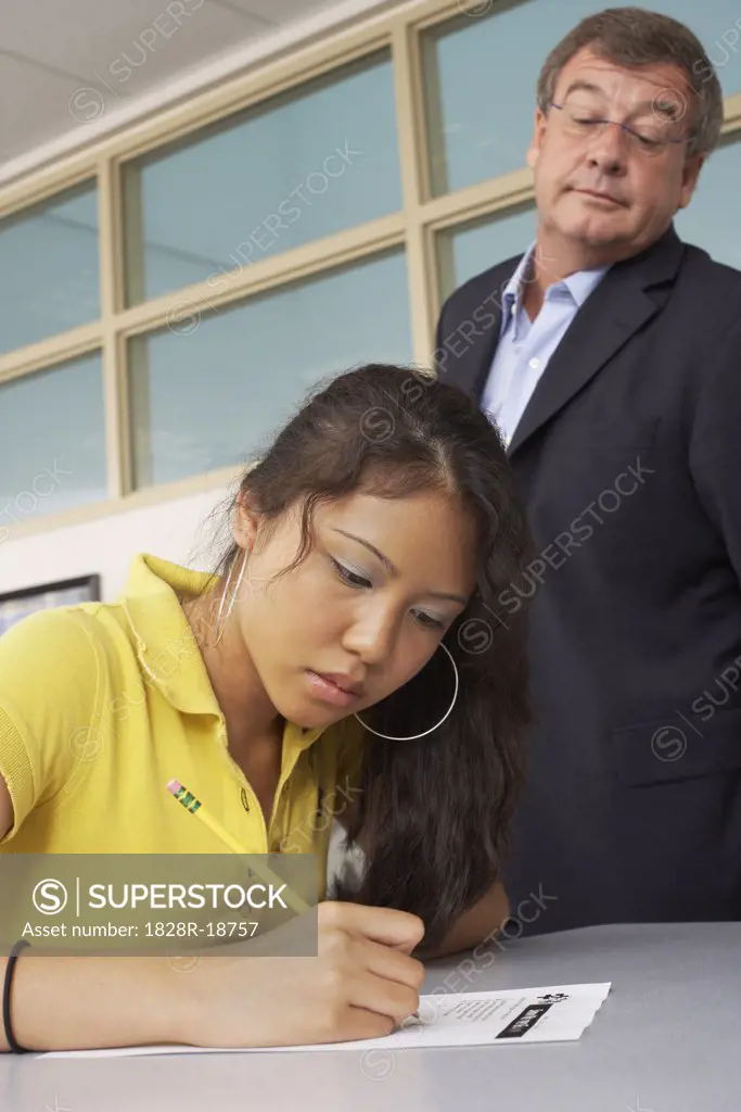 Teacher and Student in Classroom   