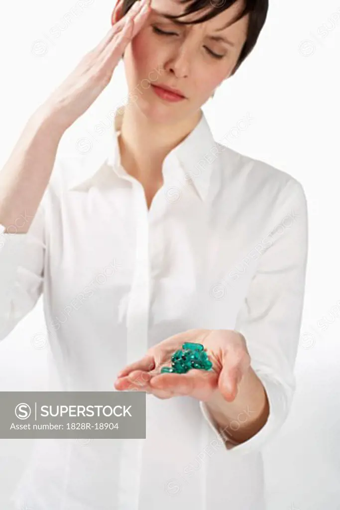 Woman with Handful of Pills   