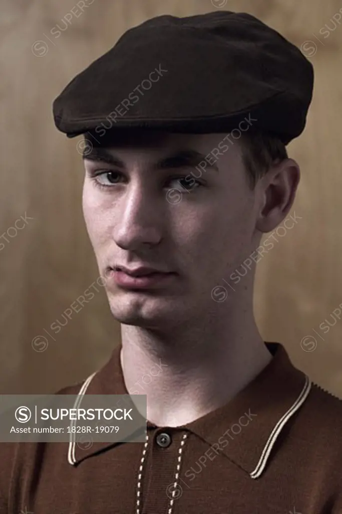 Portrait of Young Man Wearing Cap   