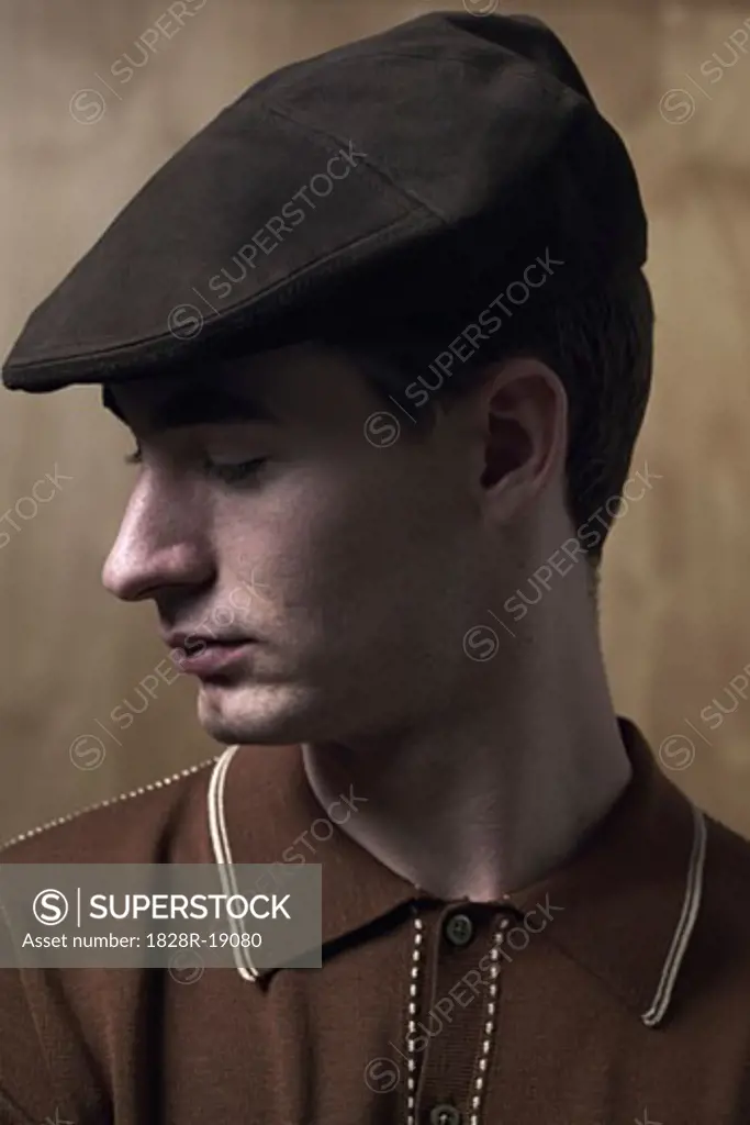 Portrait of Young Man Wearing Cap   
