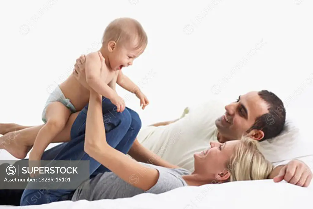 Mother and Father Playing with Baby   