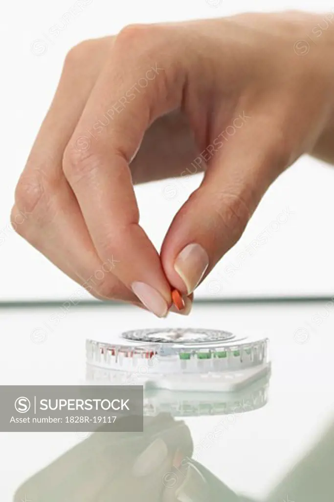 Hand Holding Birth Control Pill   