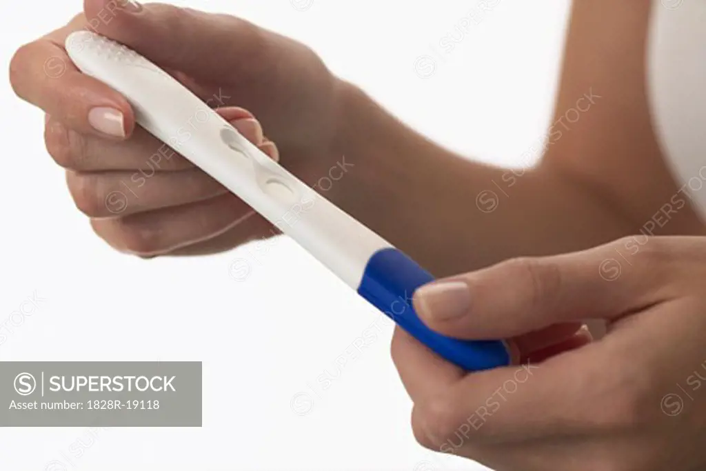 Woman Holding Pregnancy Test   