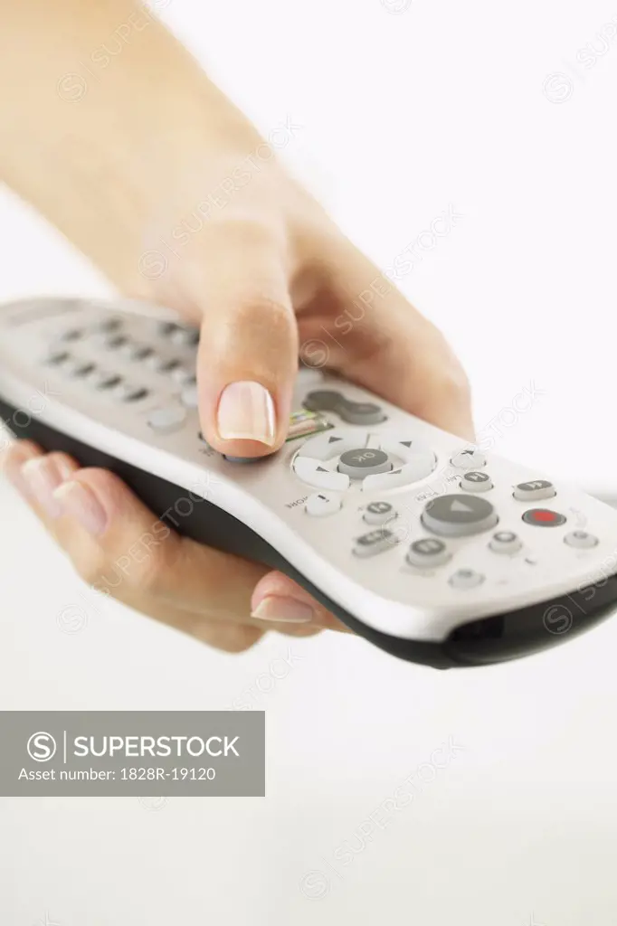 Hand Holding Remote Control   