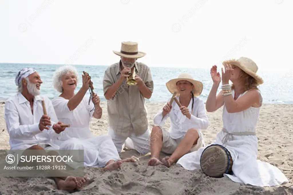 People Playing Music on Beach   