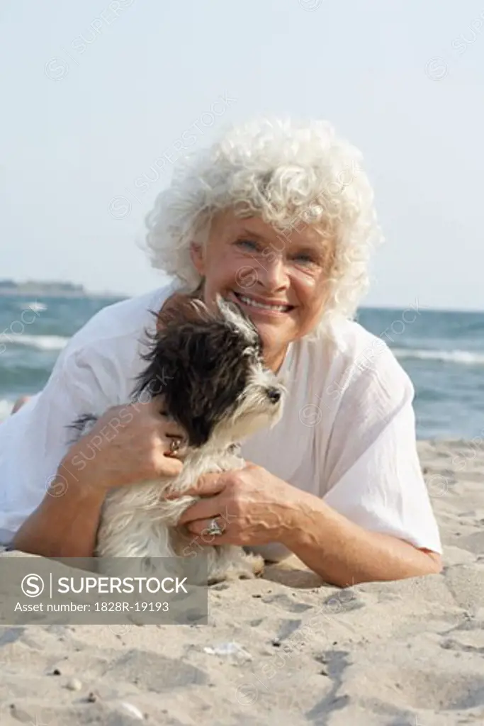 Woman with Dog on Beach   