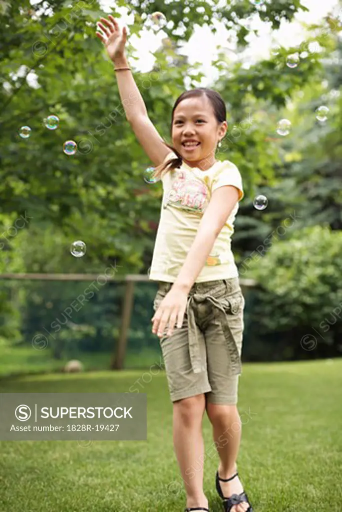 Girl Playing With Bubbles   