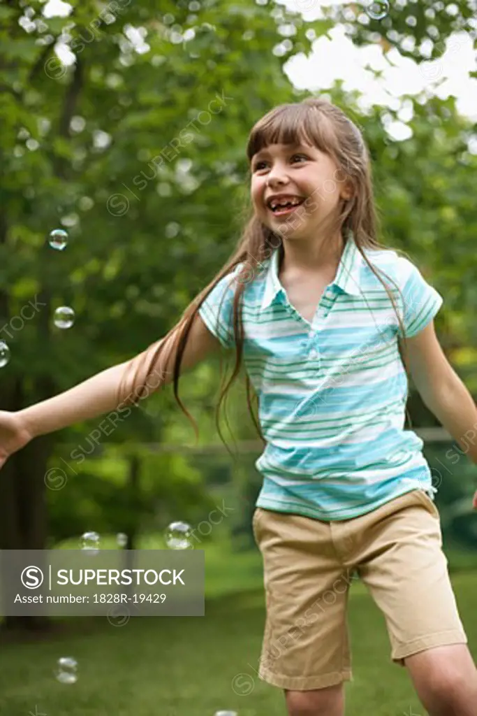 Girl Playing With Bubbles   