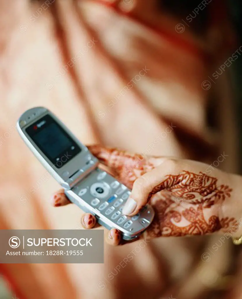 Woman Holding Cellular Phone   