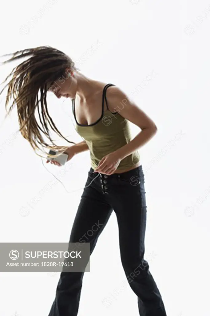 Woman Using MP3 Player   