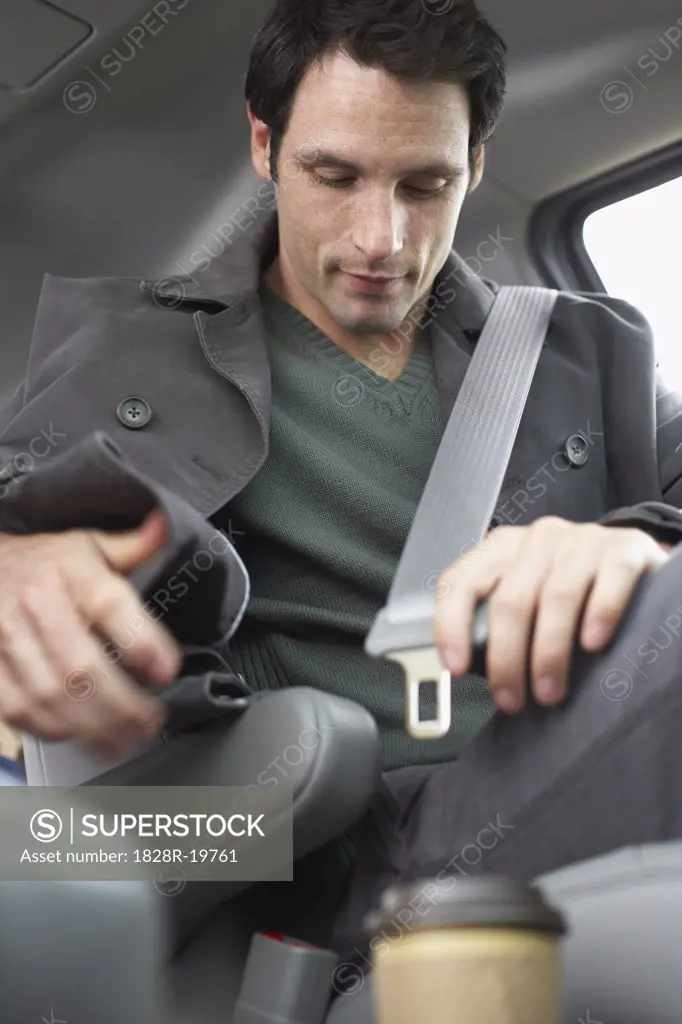 Man Buckling Seatbelt   