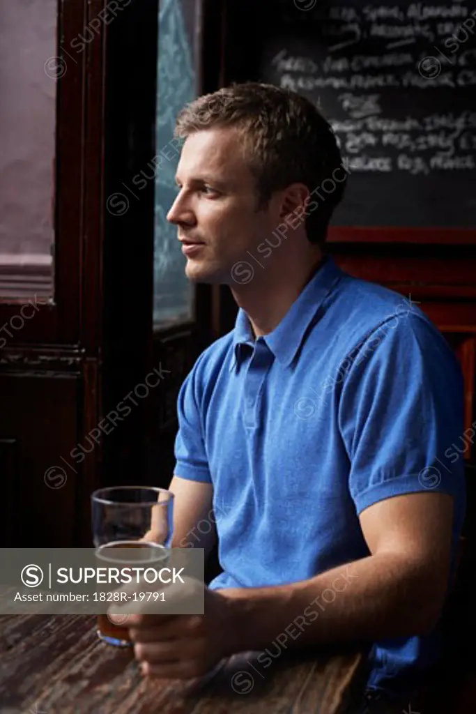 Man Sitting in Pub   