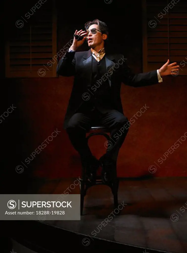 Man Singing on Stage   
