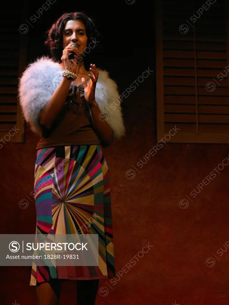 Woman Singing on Stage   