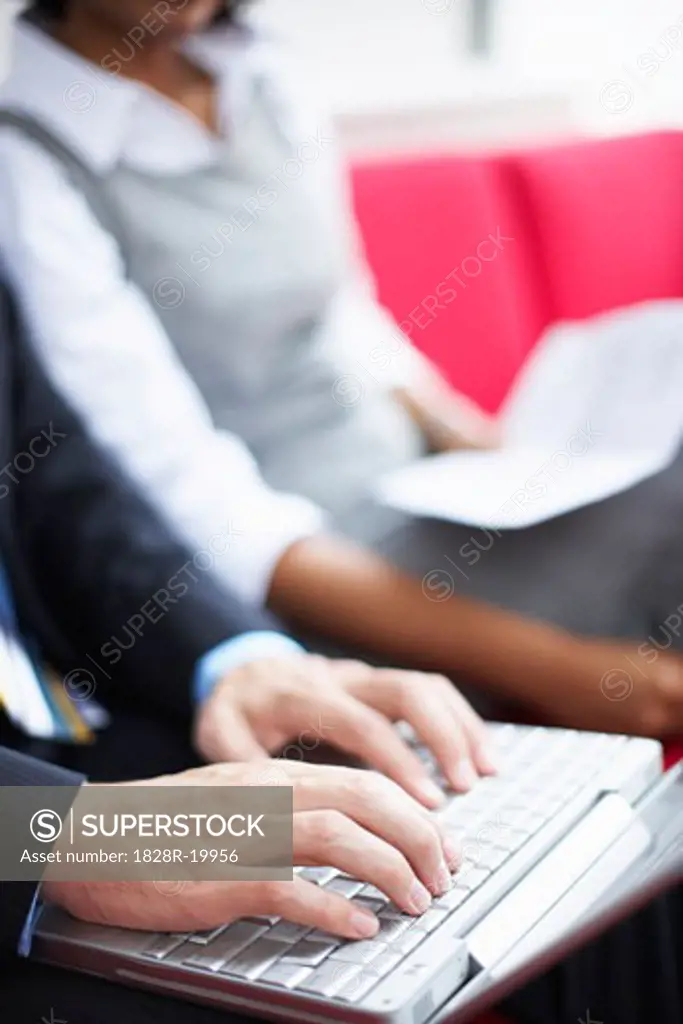 Man's Hands Typing on Laptop Computer   