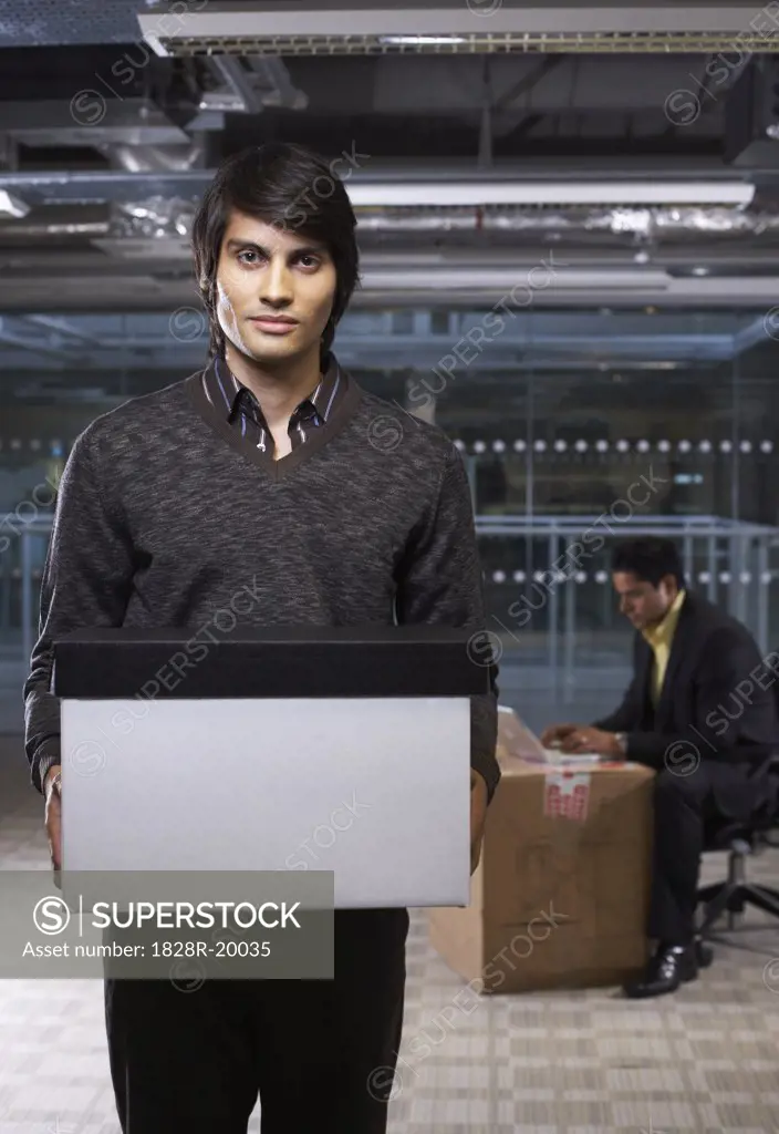 Businessman Holding Box   