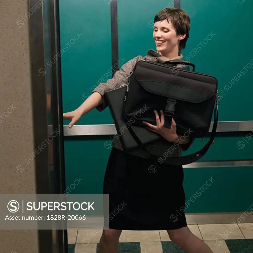 Businesswoman in Elevator   