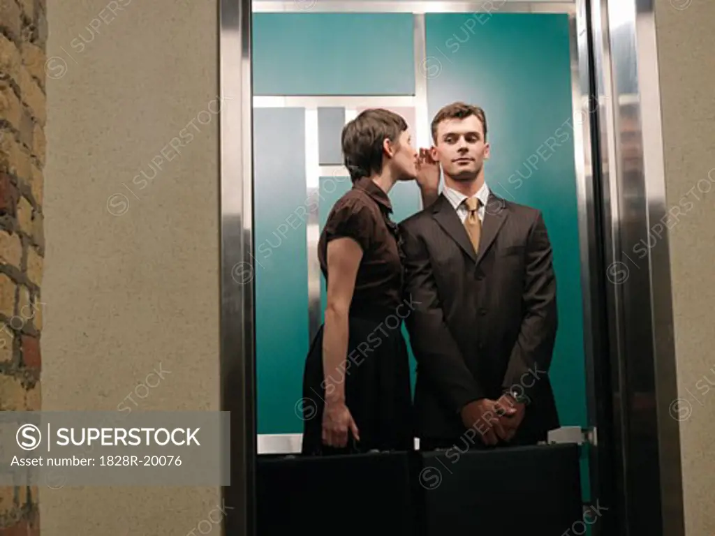 Business People in Elevator   
