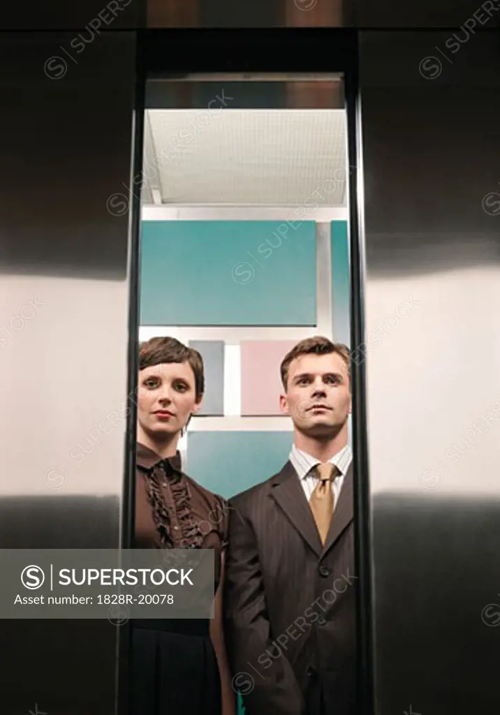 Business People in Elevator   