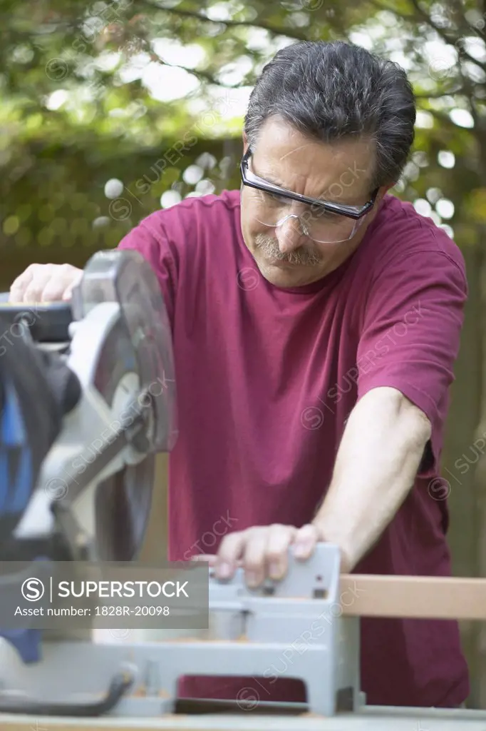 Man Cutting Wood   